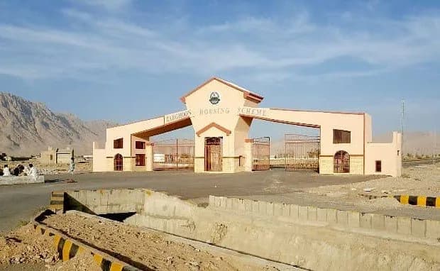 The entrance gate of Zarghoon Housing Scheme, Quetta, with hills behind