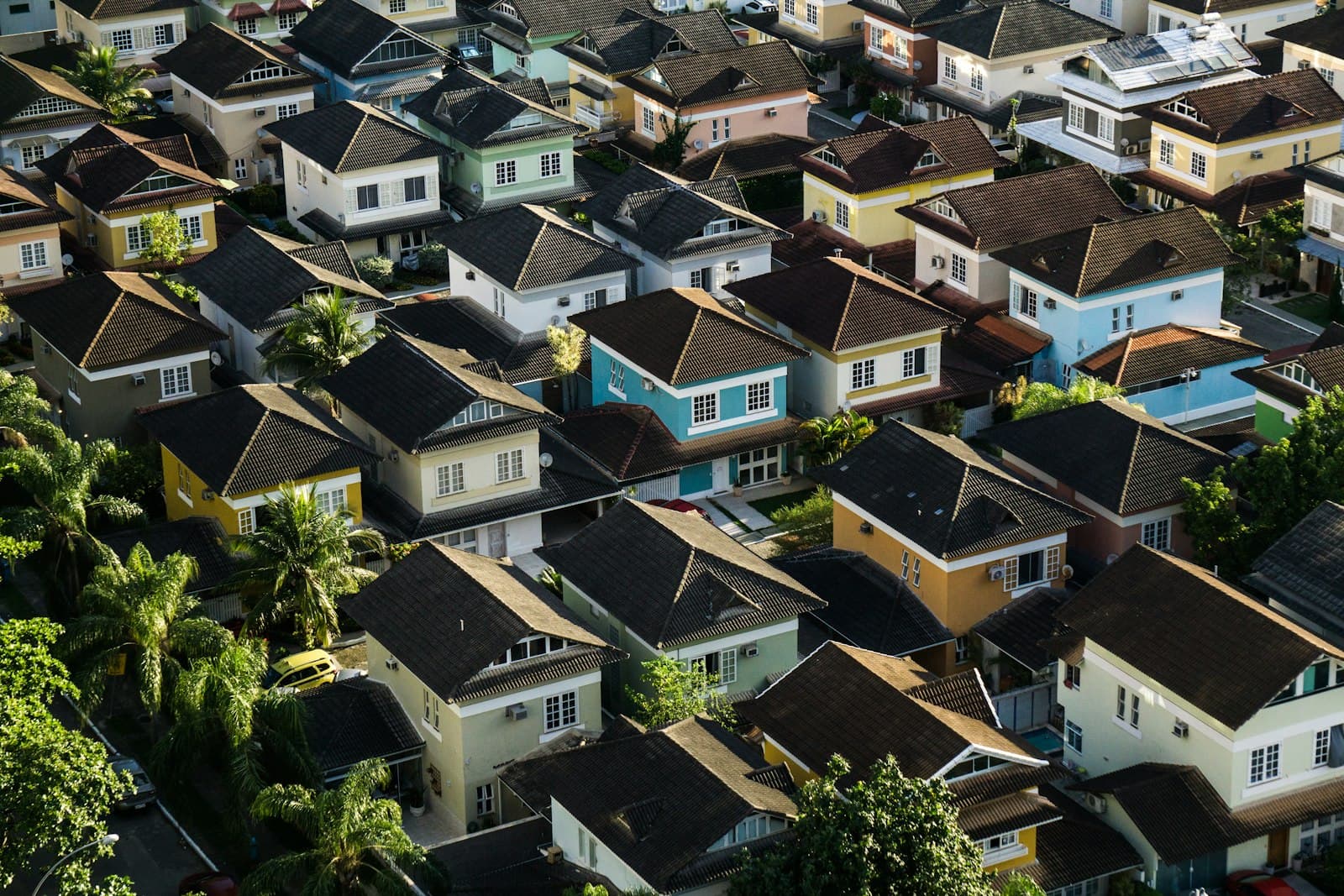 Aerial view of a housing society with plots and houses